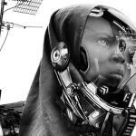 Image Detail: A young Muslim girl holding an antenna and wearing an oxygen mask.