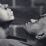 Image Detail: This photo of "BLACK VELVET" was taken at Governor's Island, NYC in 2018 by photographer Alex Apt. The subjects are performers Mirelle Martins and Shamel Pitts. The moment captured symbolizes the soothing embrace of one's other half as a reflection of self.
