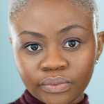 Headshot of Hope Olaidé Wilson over blue/gray background
