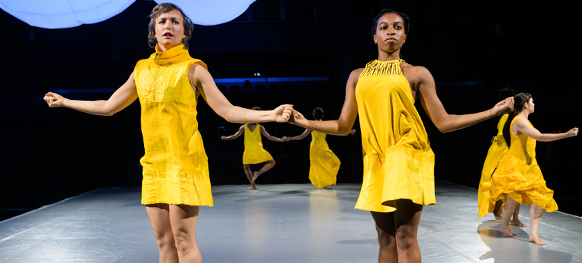 Image: Photo by Ian Douglas of Natalie Green and Aja Carthon jumping with straight legs (foreground); Brittany Engel-Adams and Nola Sporn Smith in a coupé plié (background); Angie Pittman and Pareena Lim in parallel plié; all dancers with arms bent at the elbow. Set design by New Affiliates in the upper left corner. "March Under an Empty reign," The Joyce Theater NY Quadrille, October 0218.