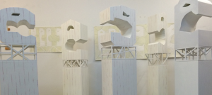 Image Detail: Jerome Johnson (Fellow in Craft/Sculpture '17), "Five Techno-Head Sculptures," 2014-15, wood, gesso and encaustic. Each sculpture is a single geometric humanoid head, a hand-built hollow wood form placed atop of a trestled base. Their architectural profiles are ideally shown together contrasting their expressive and geometric relationships. Their encaustic surfaces are white with magenta striations.