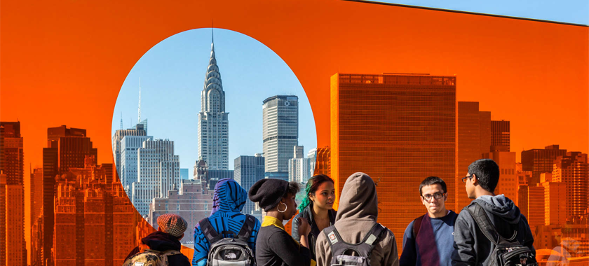 Image: Photo detail of a bright orange transparent plexiglass, installed at a NYC public school with a clear circle highlighting the Chrysler Building.