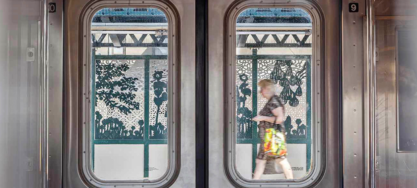 Image: Detail of a photo of Saya Woolfalk's "Urban Garden Rail" subway platform installation, as viewed through subway doors