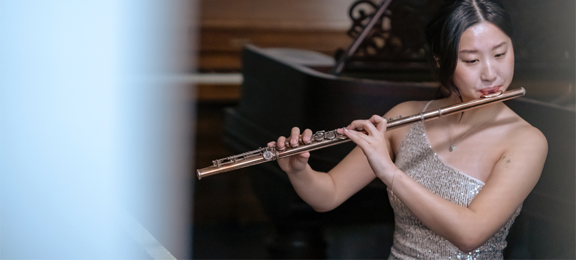 Eva Ding portrait playing flute