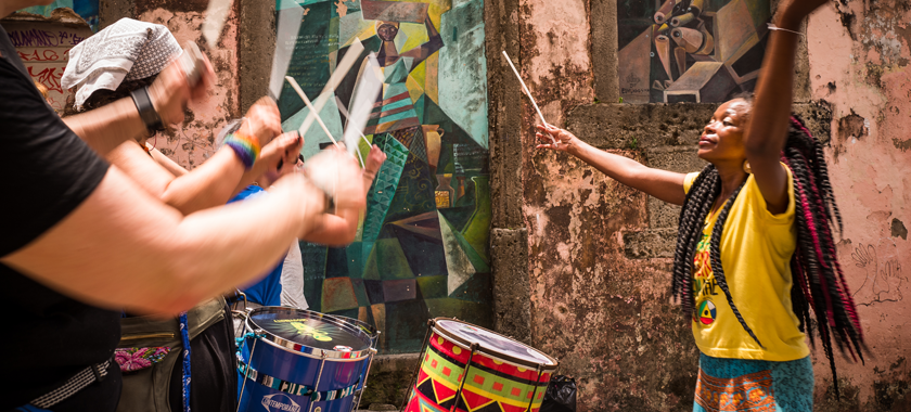 Adriana Portela conducts the all-female, samba reggae drumming bands Dida & Fogo Azul