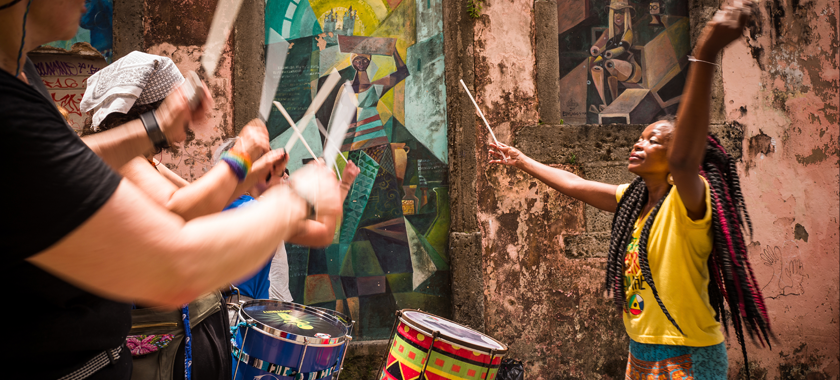 Adriana Portela conducts the all-female, samba reggae drumming bands Dida & Fogo Azul