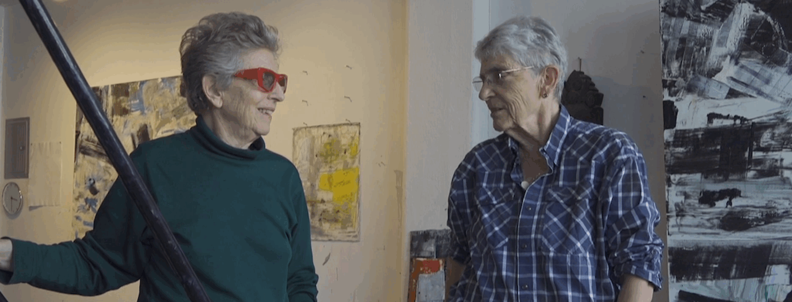 Film still of painter Louise Fishman and Esther Newton meeting in Louise's art studio.