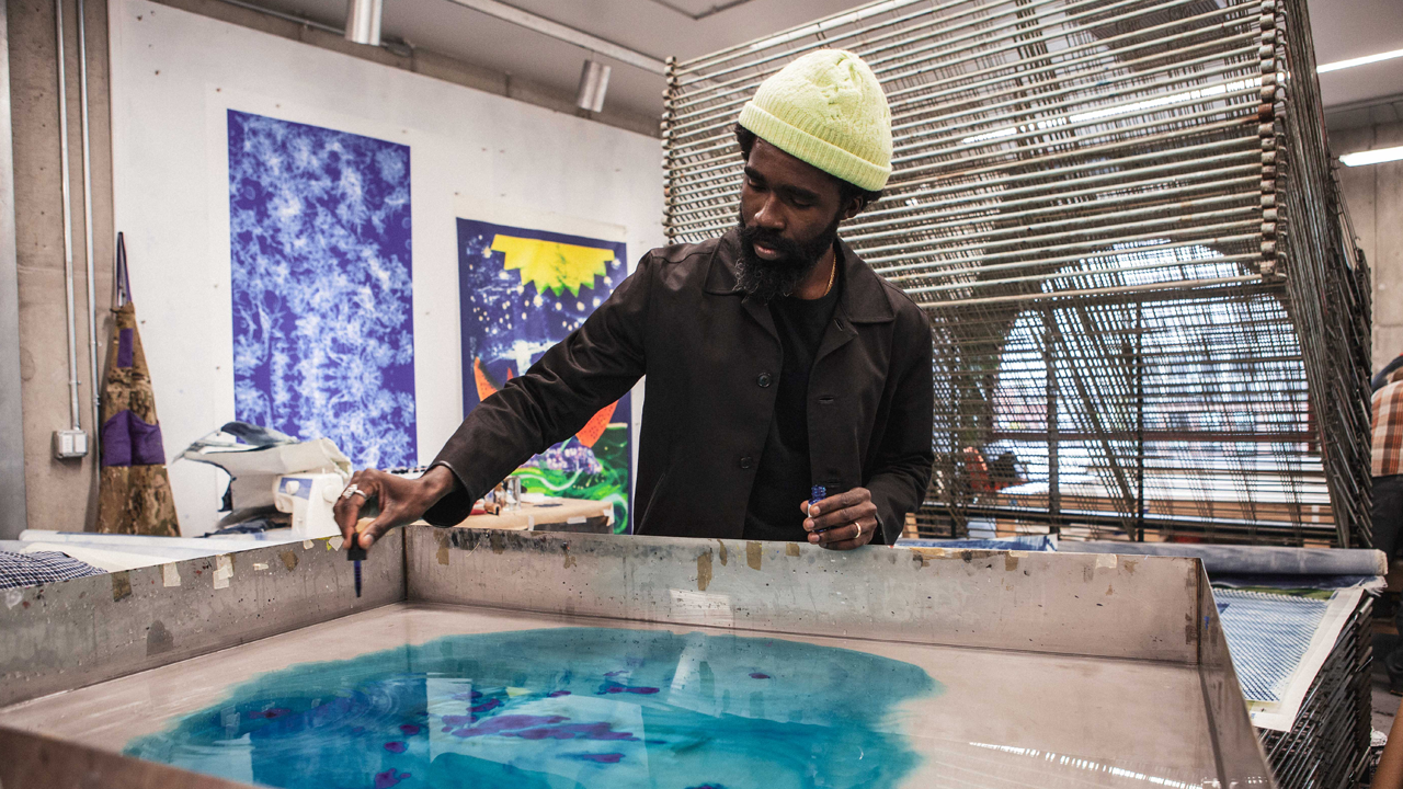 Former Powerhouse Arts Artist in Residence Ivan Ford working in the Print Shop