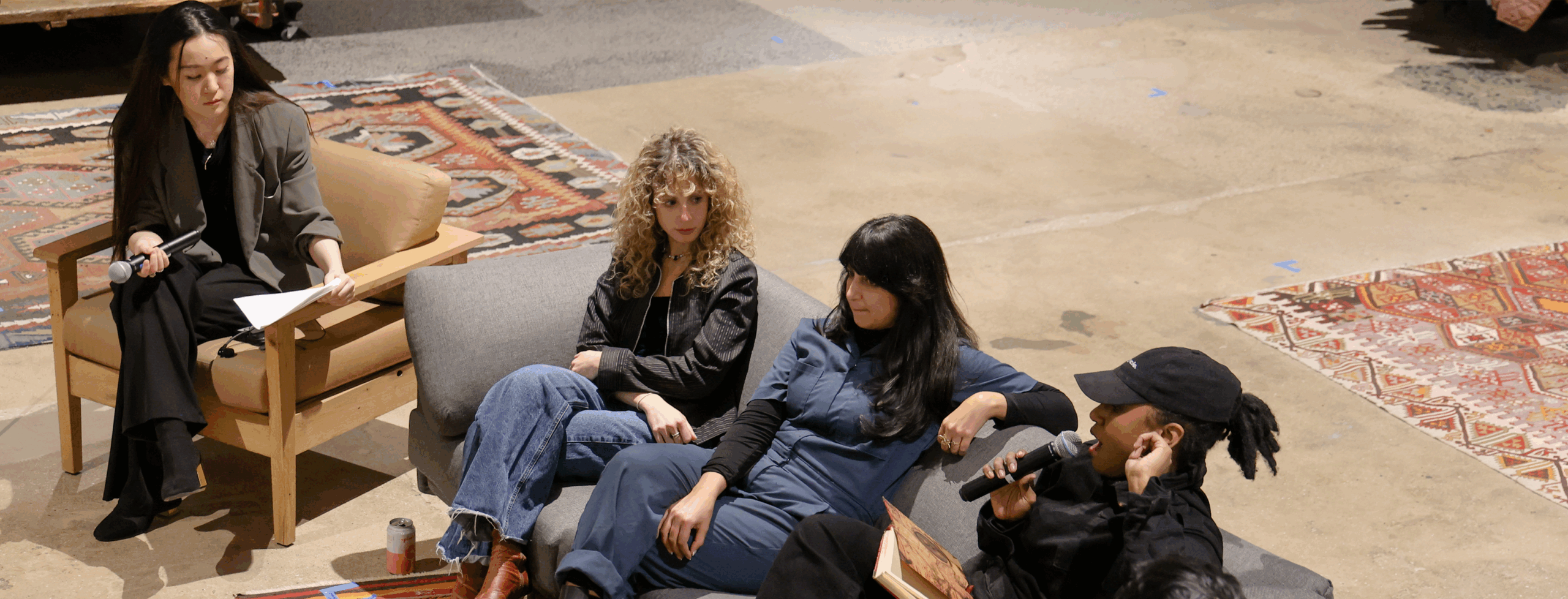 Four individuals are seated and in conversation as part of a panel discussion at Patagonia Brooklyn