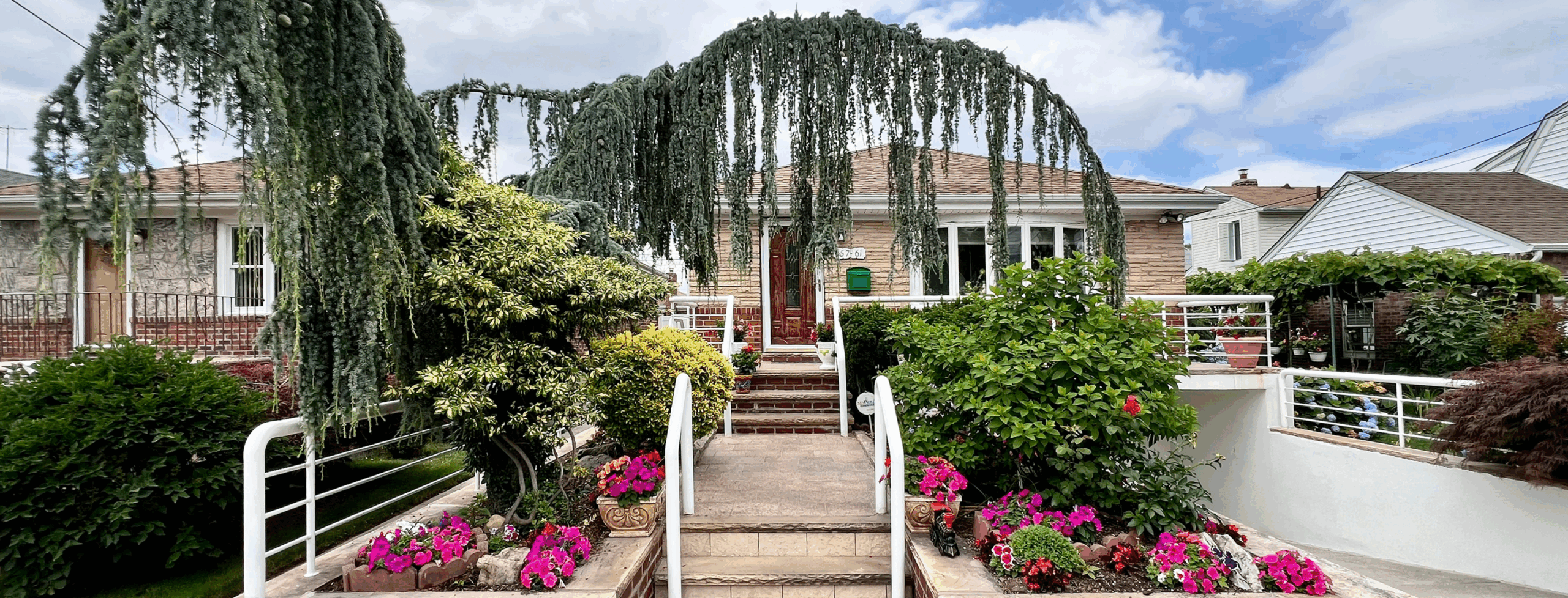Photograph of front yard in the Queens neighborhood of Broadway-Flushing, taken during Herrin-Ferri's borough-wide garden survey last summer
