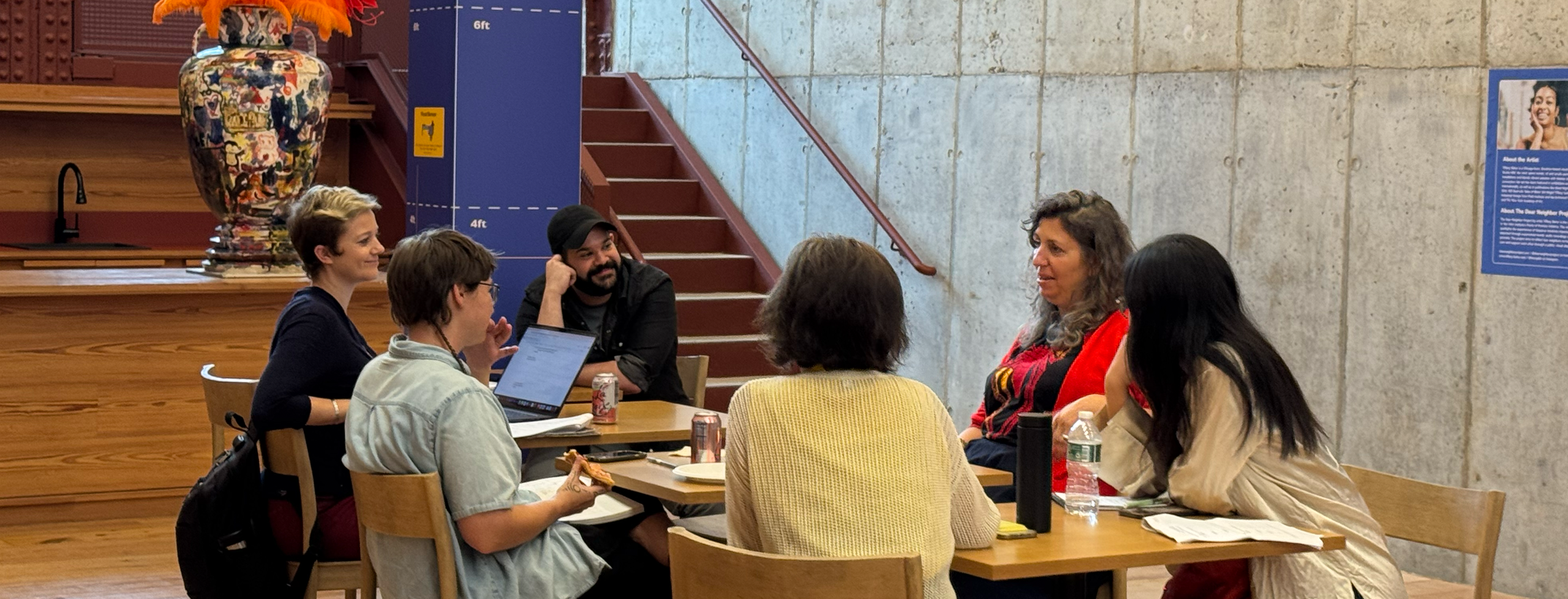 Six Artist as Entrepreneur participants gather in a small breakout group at Powerhouse Arts in Brooklyn