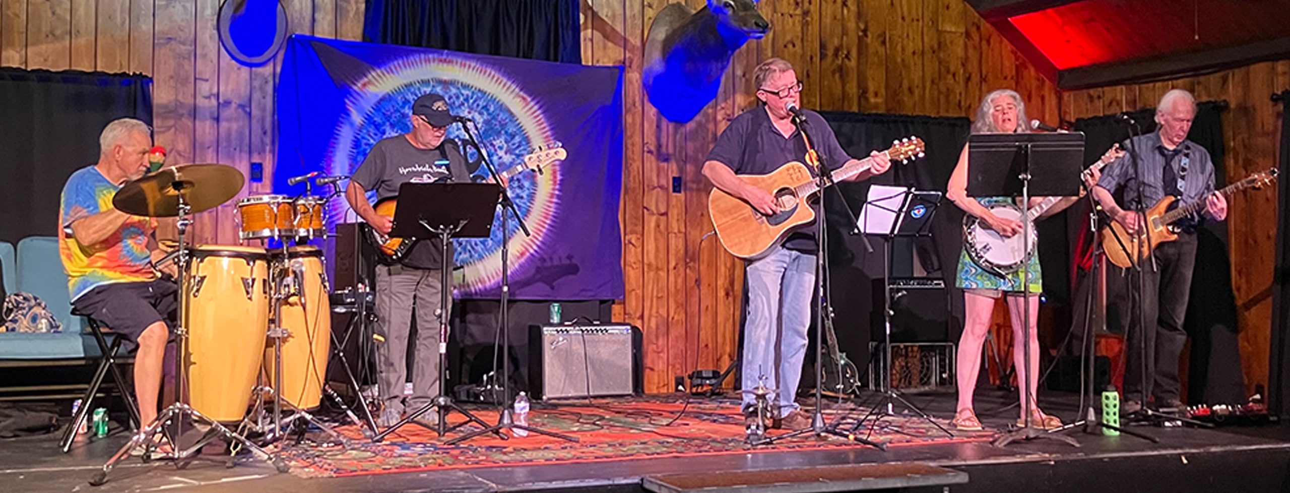 Image of a band performing on a small stage