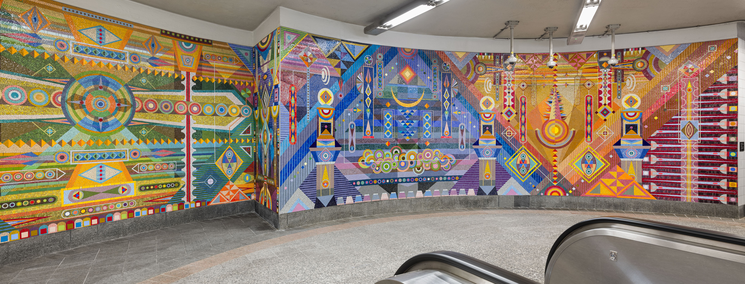 Colorful, geometric mural of mosaic tiles by Hilma's Ghost at Grand Central Terminal in New York, NY