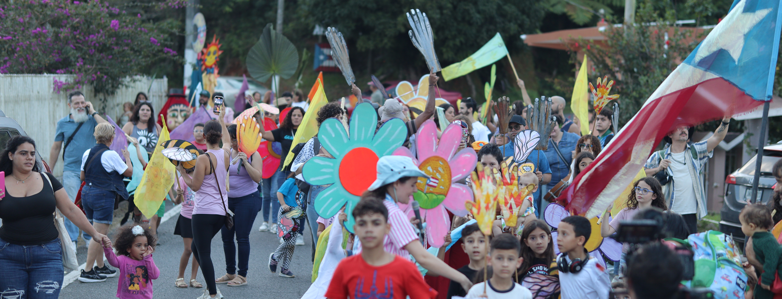Image of a vibrant parade making its way down a street in Puerto Rico