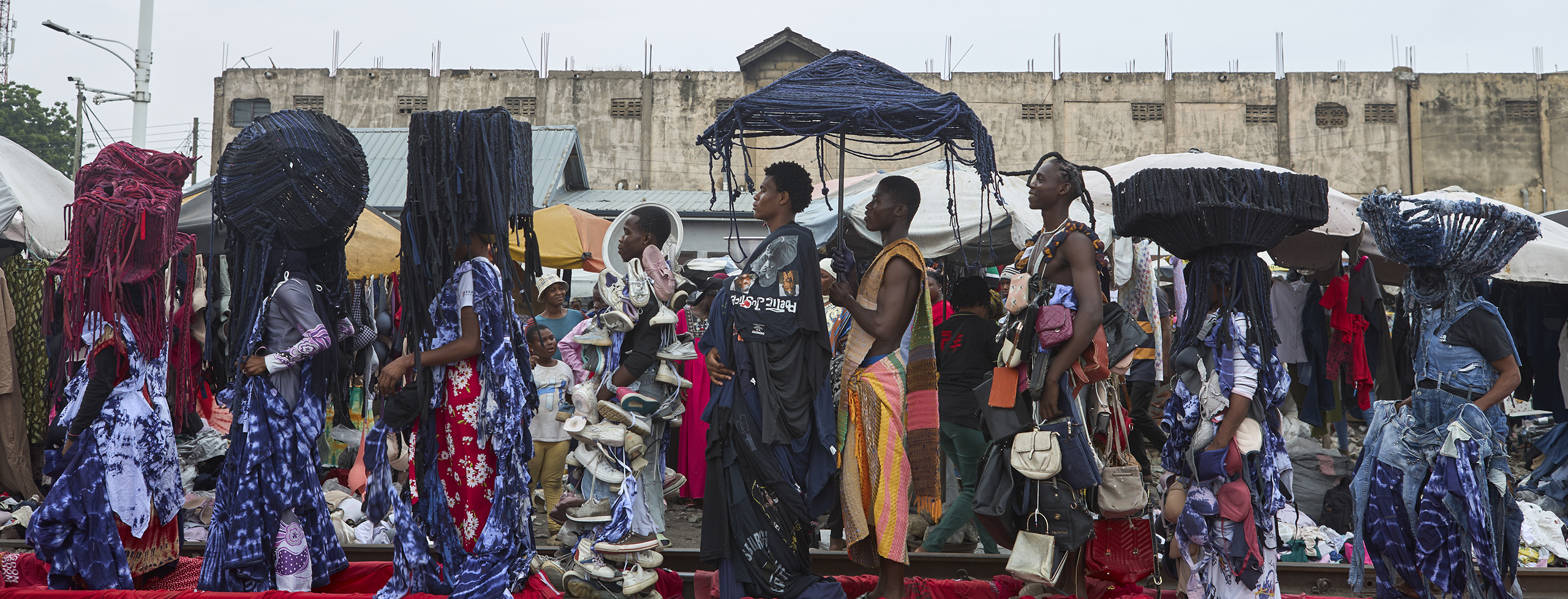 Runway show in a busy marketplace