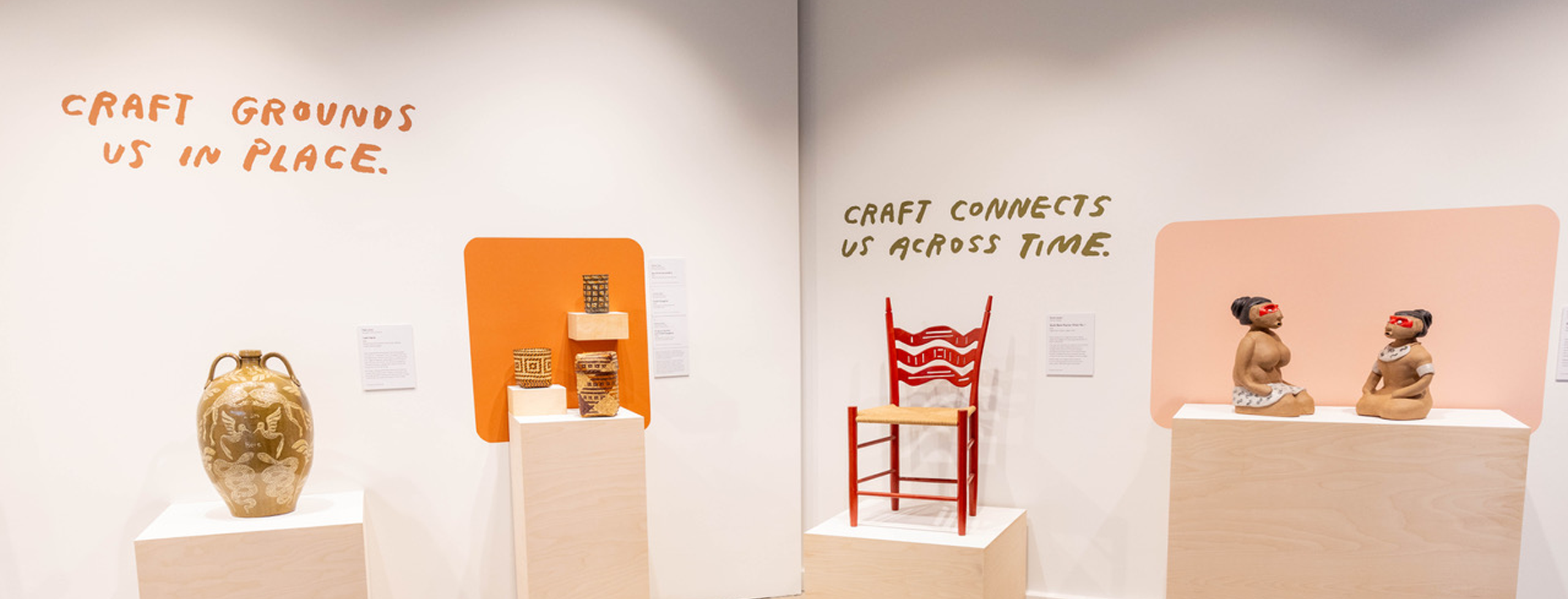 "Connections in the Making" installation view, with wall text that reads "Craft grounds us in place. Craft connects us across time."
